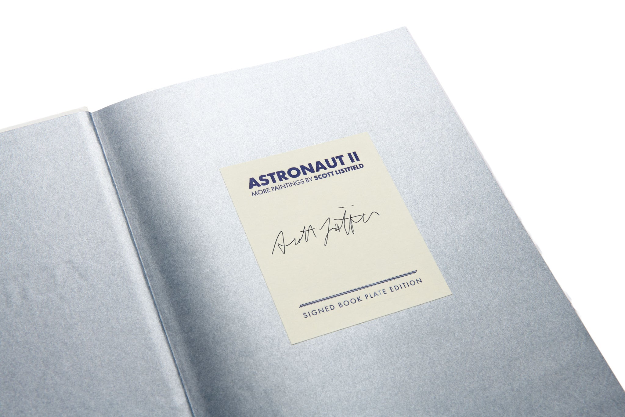 Silver-bound book with a label on a white background