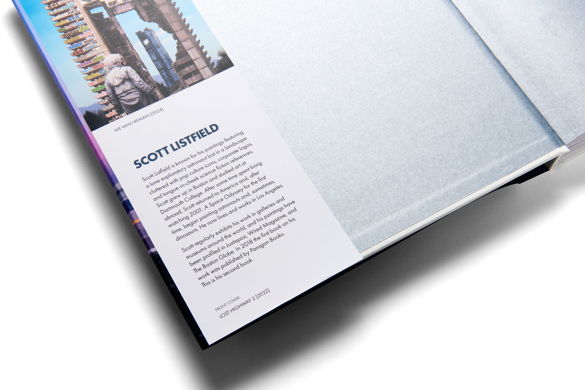 Open book with a page featuring text and a photo of a person, on a white background